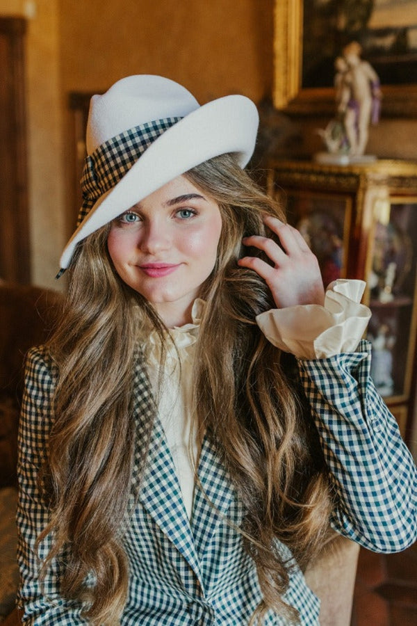 Delicate lucid white fedora hat with wide plaid band.