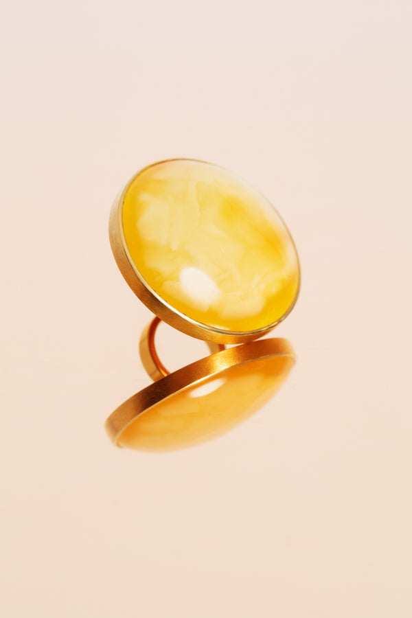 Gold-plated sterling silver statement ring with an oversized amber.