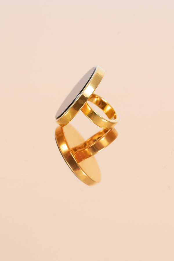 Elegant gold-plated sterling silver ring with round onyx.