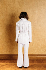 Bold tailored white denim safari jacket.