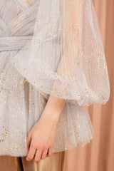 Glamorous glittery sheer blouse made of misty white tulle and lined with 100 % silk.