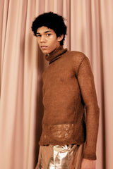 Wonderfully soft sheer knitted turtleneck in 100 % mohair as a warm base layer or a statement top.