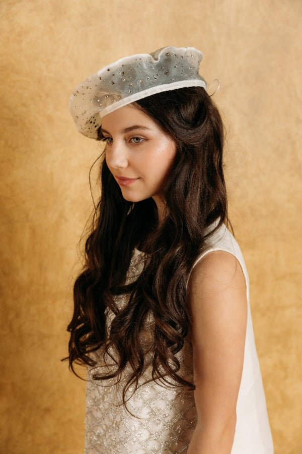 Delicate creamy white silk beret embellished with bright crystals