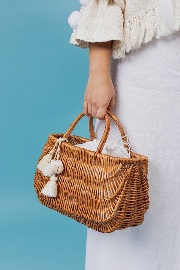 Exquisite wicker tote bag with a double handle and linen inner bag that has a cotton lining express refined charm.