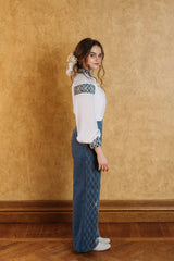 Swan blue velvet wide trousers, with crossed silver thread stitching.