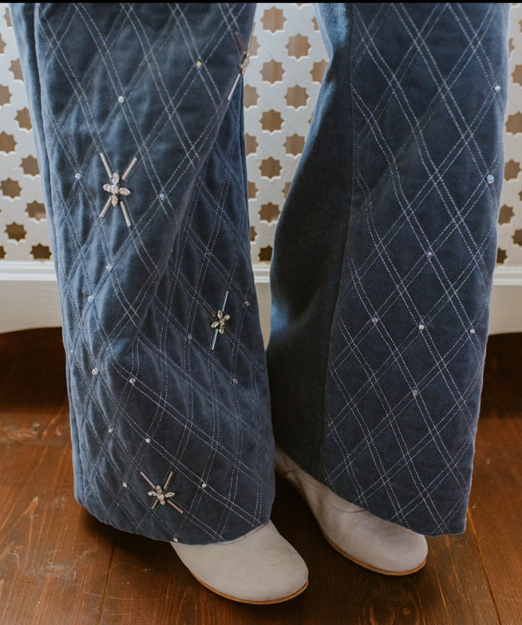 Swan blue velvet wide trousers, with crossed silver thread stitching.
