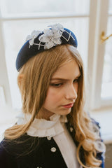 Dark night blue quilted headband with embellished crystals and silver flowers.