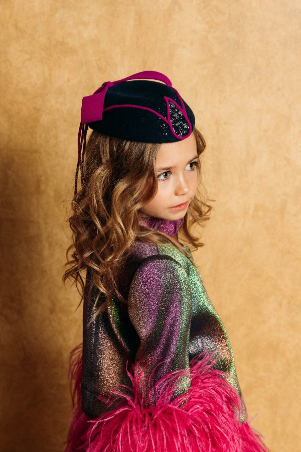 Magical chameleon jacket with magnificent fuchsia feathers along bottom and cuffs.