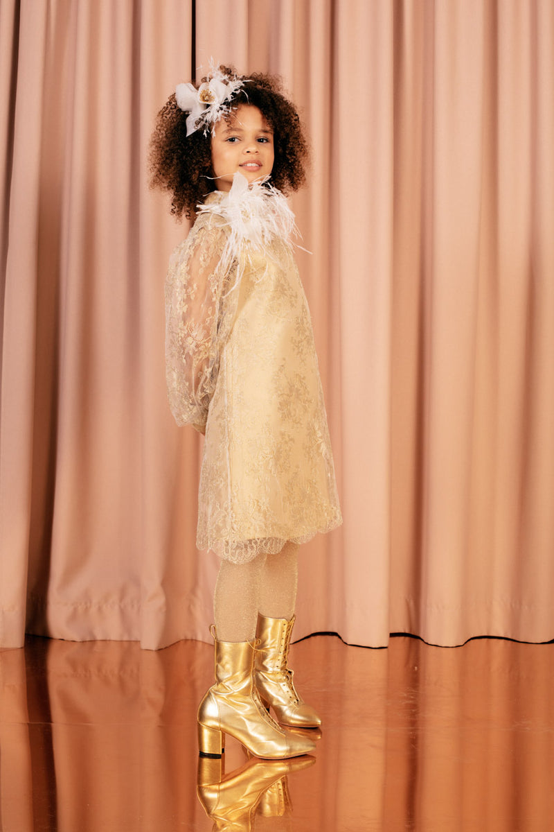 Beige knee-length A line lace dress with sheer bishop sleeves and a soft 100 % silk lining.